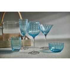 blue glassware is sitting on a table