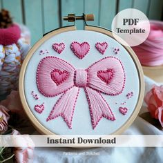 a pink bow with hearts on it is featured in this hand embroidery pattern, and the text instant download