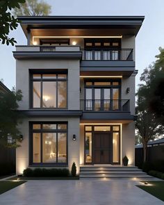 a modern house with lots of windows and lights