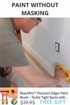 a man is painting the wall with yellow paint and holding a pair of pliers