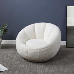 a white chair sitting on top of a carpeted floor