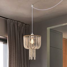 a chandelier hanging from the ceiling in a bedroom