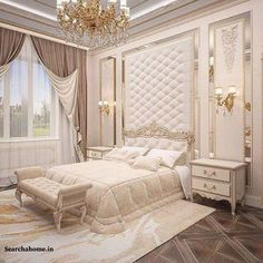 an elegant bedroom with white furniture and chandelier