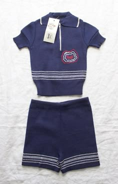 "VINTAGE 70's, stunning little knitted set, polo top and matching shorts, high quality cotton in navy blue / white colours, \" Booh \" embroidery, made in Italy. Measurements : Length \" / Width ( underarms ) \". Size 1 year Vintage condition level 5, new old stock We assess the condition of our vintage items on a scale from 0 to 5. Level 5 corresponds to an almost new vintage condition. Any defects are systematically reported. Even though in very good condition, vintage items may present imperf Knitted Shorts, Polo Outfit, Australia Fashion, Vintage Sportswear, Level 5, Polo Top, Knitted Romper, Diva Fashion, Clothing Sets