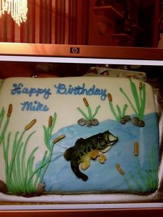 a birthday cake with a fish on it