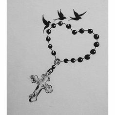 a drawing of a rosary with a cross and two birds flying above it on a white background