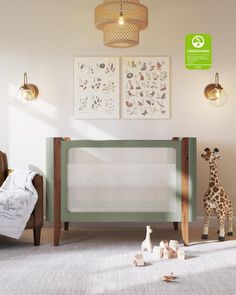 a baby's room with a crib, chair and giraffe toy