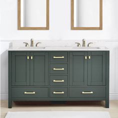 two mirrors are above the double sink vanity in this white and green bathroom with gold trim