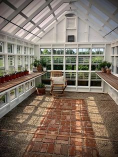 the inside of a greenhouse with lots of windows