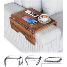 a coffee table with a cell phone and remote control on it next to a couch