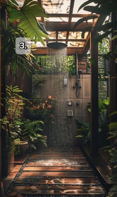 an outdoor shower surrounded by plants and greenery is featured in this image with the number 3 on it