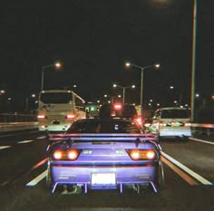 cars driving down the highway at night time