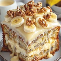 a piece of cake with bananas and nuts on top