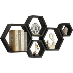 three hexagonal shelves holding books and other items