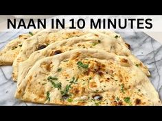 three flat breads on top of a towel with the words naan in 10 minutes