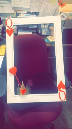 an office cubicle decorated to look like a princess's crown and holding a heart