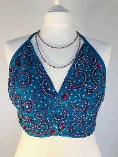 This Stunning Goddess Boho Top is up-cycled from a Vintage Silk Indian Sari, therefore completely one of a kind. A Beautiful Turquoise Chiffon Cropped top with Gorgeous Silver and Fuchsia Pink Embellishment featuring 100's of Pretty Sparkling Beads ,Sequins and Crystals. A very sexy flattering shape , with halter ties and 2 back ties to adjust the fit , which Shimmers, for special beach lunches , festivals, summer evenings and Parties. Will fit Uk size 10 to 14 ( US 6 to 10). Fully lined cups in Beach Lunches, Glitter Bra, Ibiza Holiday, Beaded Bra, Fashion Show Themes, Chiffon Crop Top, Glitter Party, Holiday Tops, Festival Tops