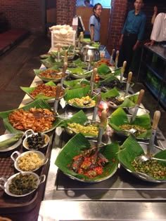 a buffet table filled with lots of food