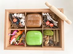 an open cardboard box filled with different types of toys