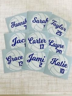 four basketball name tags with the names of each team and number in blue on them