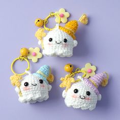 three crocheted key chains with cute little animals on them, one is wearing a crown and the other has a bee