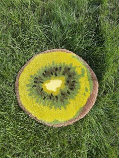 a green and yellow object in the grass