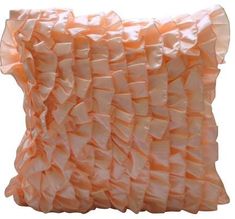 an orange pillow with ruffles on it