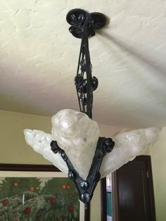 a chandelier hanging from the ceiling in a room