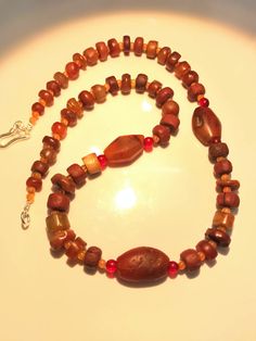 A beautiful collection of very old ancient Carnelian Beads , Carnelian Beads, . They are found in Afghanistan, India, Pakistan and Tibet. They can be used to make a beautiful contemporary designed necklaces. Each bead is authentic and old. Highly collectible 9 pictures are there you can swipe each to see all pictures silver lock 95.5with the necklace Artisan Red Carnelian Beaded Necklace, Artisan Red Carnelian Beaded Necklaces, Brown Carnelian Gemstone Necklace, Brown Carnelian Gemstone Necklaces, Brown Carnelian Beaded Jewelry, Handmade Amber Carnelian Beaded Necklaces, Artisan Carnelian Beaded Necklace, Artisan Carnelian Beaded Necklaces, Artisan Brown Carnelian Necklace