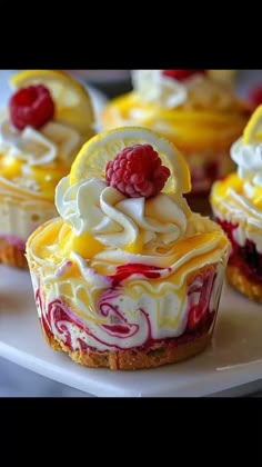 small desserts with raspberry and lemon filling on a white plate, ready to be eaten