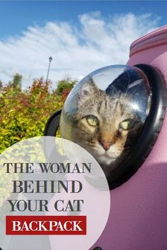 a cat peeking out from behind a pink suitcase with the caption, the woman behind your cat backpack