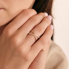 1- D E S C R I P T I O N Stylish and sophisticated, this Diamond Criss Cross Ring in 14K Solid Gold is a must-have for your jewelry collection. Perfect for stacking or wearing solo, this X-shaped ring offers a unique twist on traditional designs. Made with real gold, it's a dainty yet durable piece that makes an ideal gift for any occasion. Discover the allure of this crossover ring today. 2- P R O D U C T ∙  F E A T U R E S * Gold material: 14K solid gold * Gold color options: Yellow gold, Rose gold, White gold * Stone: Diamond Diamond Carat: 0.15 ct. Diamond Clarity: VS2 Diamond Color: F-G Diamond Cut: Excellent * Ring size options: - 5 US/CA - 5 1/4 US/CA - 5 1/2 US/CA - 5 3/4 US/CA - 6 US/CA - 6 1/4 US/CA - 6 1/2 US/CA - 6 3/4 US/CA - 7 US/CA - 7 1/4 US/CA - 7 1/2 US/CA - 7 3/4 US/CA - Criss Cross Ring Diamond, Fine Jewelry 14k Gold Infinity Diamond Ring, 14k Gold Infinity Diamond Ring Fine Jewelry, 14k Gold Diamond Infinity Ring, 14k Gold Infinity Diamond Ring, Infinity Diamond Cut Fine Jewelry Ring, 14k White Gold Infinity Diamond Ring, Stylish Gold Rings For Women, Gold Ring Designs Unique For Women