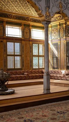 an ornately decorated room with gold and white walls