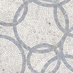 a white and blue tile pattern with circles