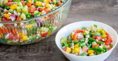 a bowl full of chopped vegetables next to a glass bowl filled with salad