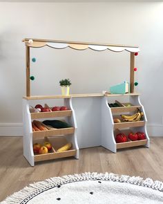 two wooden shelves with fruits and vegetables on them in front of a white wall mounted mirror