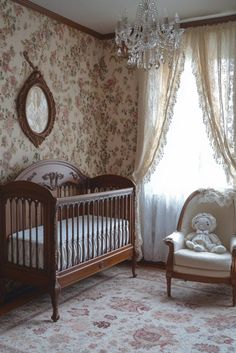 a baby's room with a crib, rocking chair and chandelier