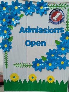 a sign with blue flowers on it that says, congratulations to the students and teachers