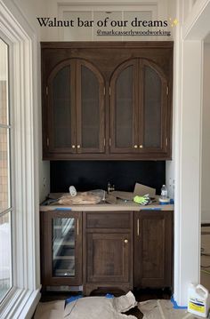 an unfinished kitchen cabinet with the words walnut bar of our dreams on it's side