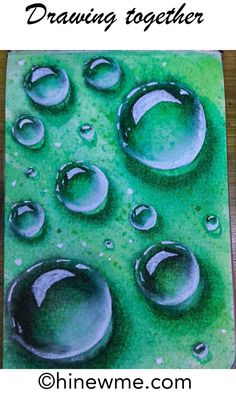 an image of some water drops on a green mat with the words, drawing together