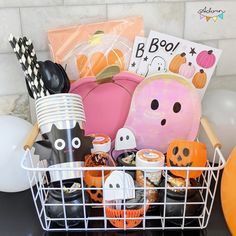 a basket filled with halloween items on top of a table