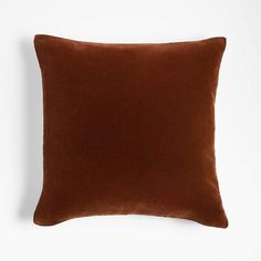 a brown pillow on a white background