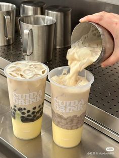 two cups filled with ice cream being poured into them