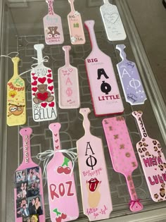 a display case filled with lots of different shaped luggage tags