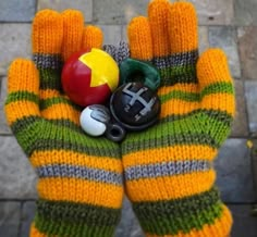 a person's hand holding an apple and other items