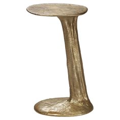 a gold colored table with a curved base