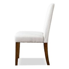 a white upholstered chair with wooden legs