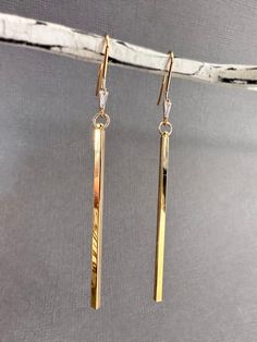 Gold Bar Drop Earrings, Luxury Everyday Linear Dangle Earrings, Golden Earrings Long, Luxury Gold-tone Dangle Linear Earrings, Luxury Dangle Linear Earrings, Long Drop Earrings Gold, Long Dangly Earrings, Gold Modern Linear Earrings For Everyday, Gold Rectangular Linear Earrings For Everyday