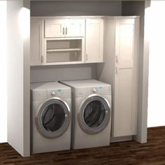 a washer and dryer are in the corner of a room with white cabinets