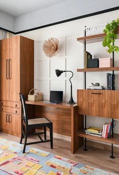 a wooden desk sitting next to a window